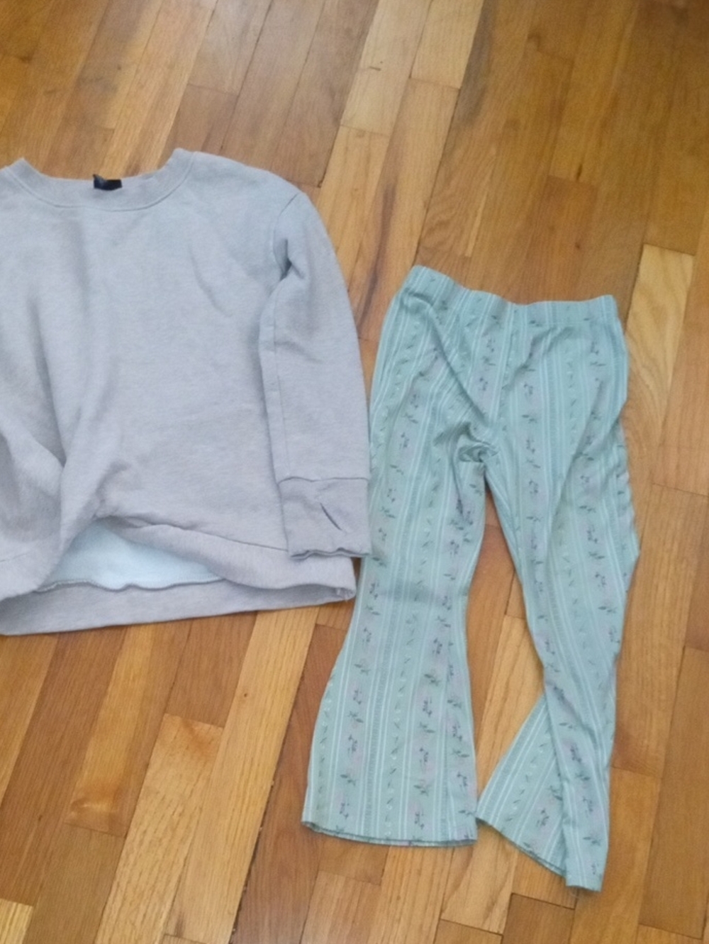 girl 6 green flower print pants, and beige sweatshirt